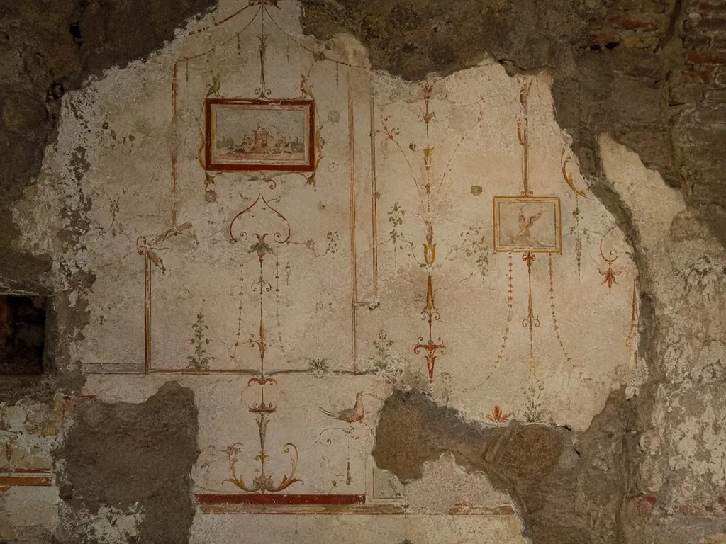 Fresco fragments on a Domus Aurea vault, with candelabra and floral motifs
